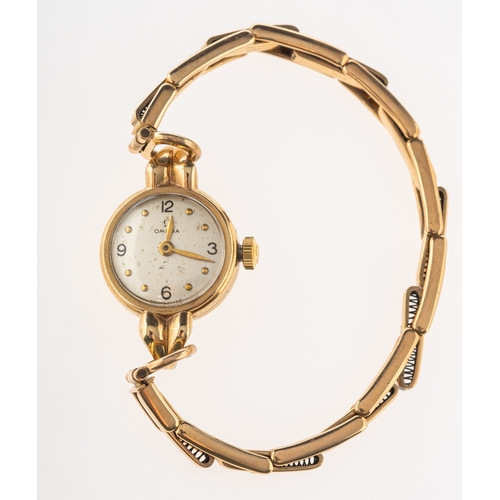 508 - Omega a lady's gold wristwatch the round silvered dial having raised dot and Arabic numerals, dauphi... 