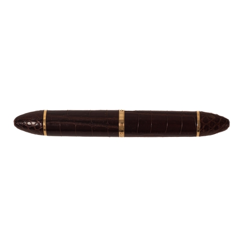 531 - Louis Vuitton. An exotic brown leather Louis Vuitton fountain pen, with gilt clip, '750' 'LV' stampe... 