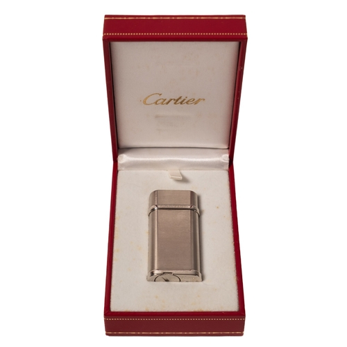 533 - Cartier. A boxed white metal Cartier lighter, stamped no. 187297 'Swiss Made' to the base, approx. 6... 