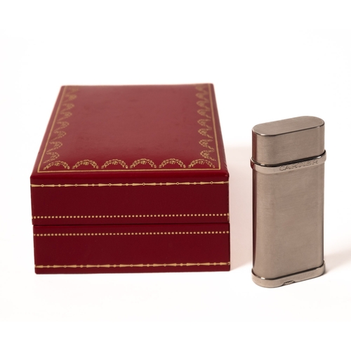 533 - Cartier. A boxed white metal Cartier lighter, stamped no. 187297 'Swiss Made' to the base, approx. 6... 