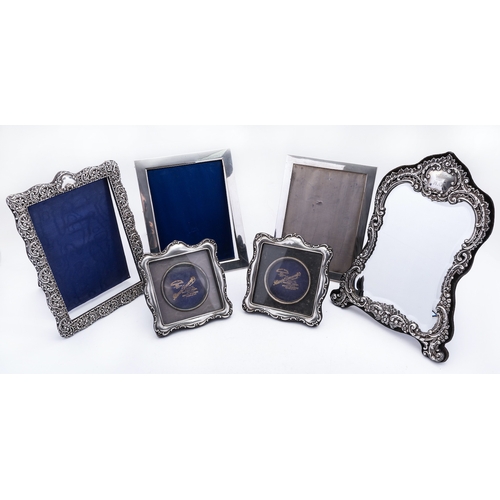 55 - A mixed group of silver photograph frames including; a pair of Birmingham silver and velvet back fra... 