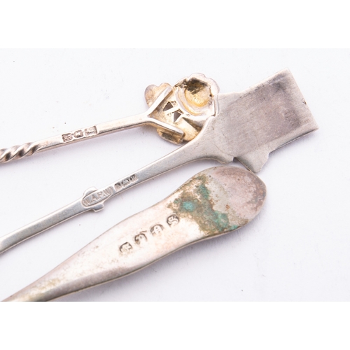 56 - A mixed group of silver including; a pair of cast Victorian tea tongs maker's mark poorly struck, Bi... 