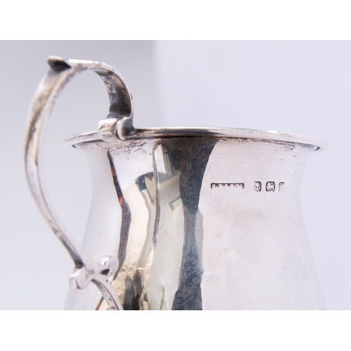 56 - A mixed group of silver including; a pair of cast Victorian tea tongs maker's mark poorly struck, Bi... 