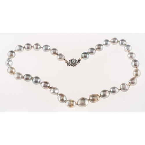 624 - A baroque pearl necklace, the pearls are of baroque shape with blue, silver and grey overtones, stru... 