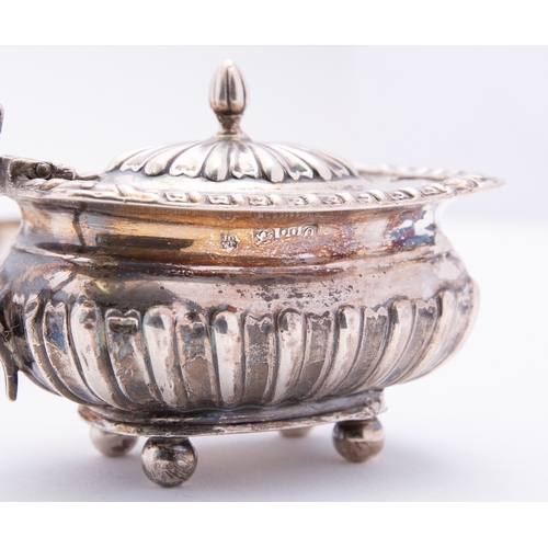 63 - A mixed group of silver including; an Edward VII egg cup with embossed decoration, a six piece Chest... 