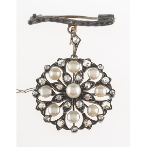 630 - A Victorian diamond and pearl brooch pendant, of openwork flower form and set with rose-cut diamonds... 