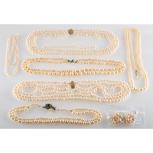 631 - A mixed group of pearl necklaces, including a three row cultured pearl necklace strung to an ornate ... 