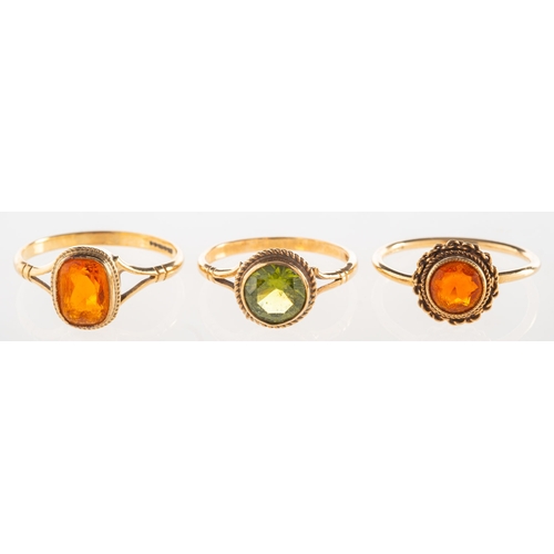 666 - A group of three 9ct gold gem-set rings, including a 9ct gold ring set with an oval-cut fire opal, U... 