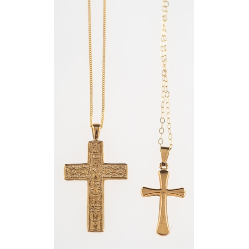 673 - Two cross pendants with chains, including a 9ct gold cross, ornately carved with Roman numerals, UK ... 