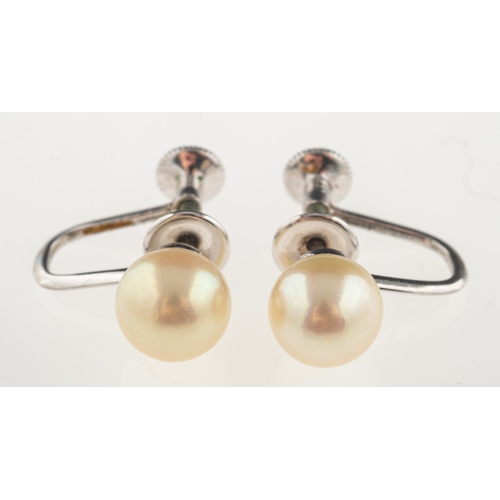 680 - Mikimoto. A pair of cultured pearl earrings, each screw back earring set with a single cultured Miki... 