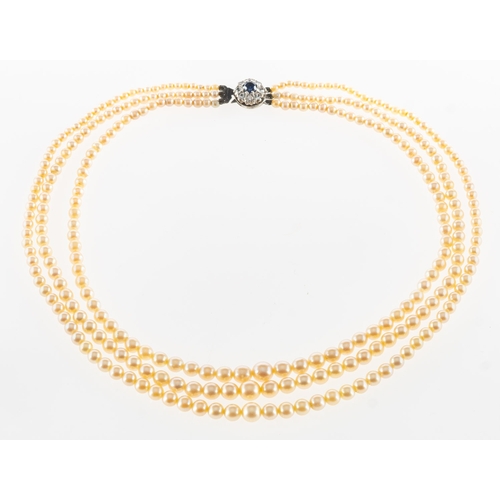 684 - A three strand pearl necklace, three strands of graduated cultured pearls, sizes range from approx. ... 