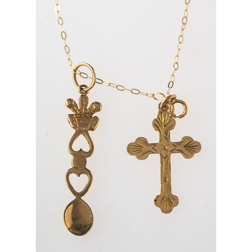 730 - A Welsh 'love' spoon pendant with chain and a cross pendant, an openwork Welsh 'love' spoon pendant,... 