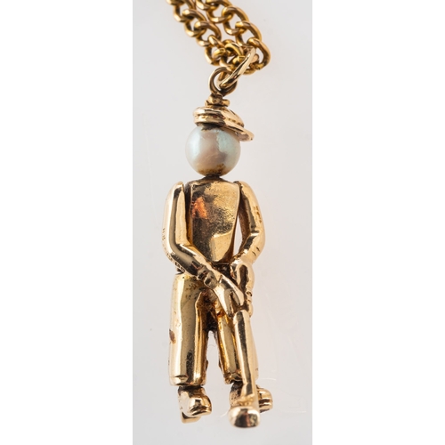 731 - A 9ct gold golfer pendant with chain, an articulated golfer pendant set with cultured pearl, UK hall... 