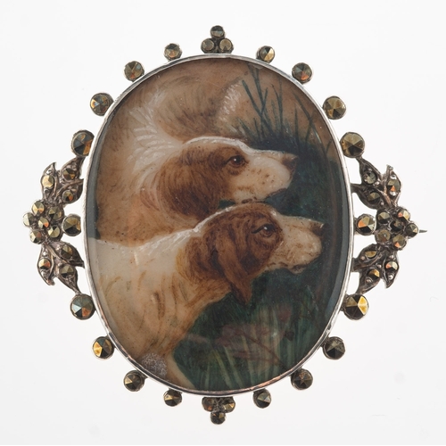 761 - A hand painted dog brooch, a white metal brooch with two hand painted pointer dogs, the openwork sur... 