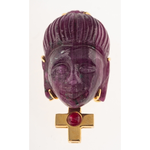 782 - A carved rough ruby pendant brooch, carved in the form of a Buddha's head with a cross below,  set w... 