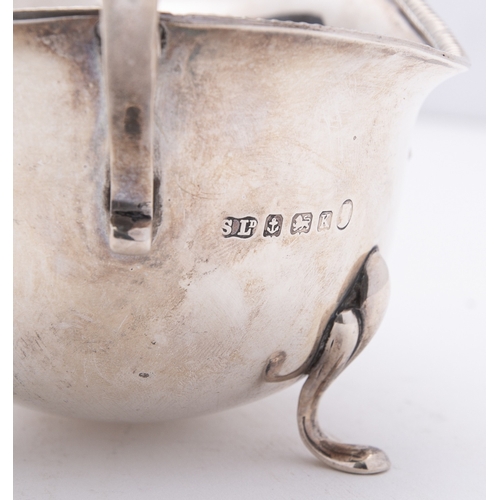 79 - A mixed group of silver including; a helmet shaped cream jug by W W Harrison & Co, Sheffield 1900, a... 