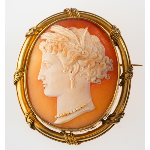 804 - A cameo brooch, with carved figural lady's head, ornate mount, unmarked, measuring approx. 5.4cm x 4... 