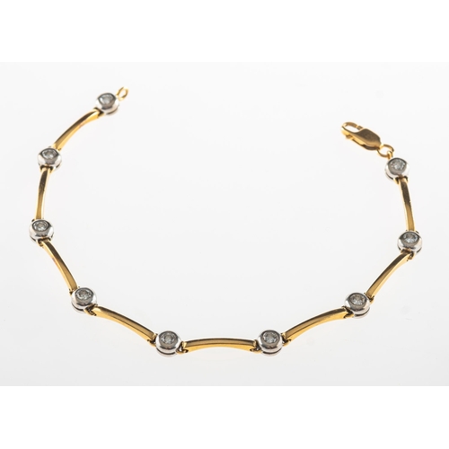 827 - A diamond line bracelet, bi-colour and of articulated bar links, interspaced by nine collet set bril... 