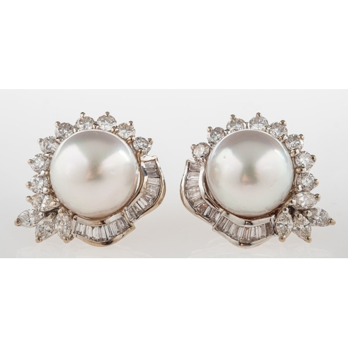 828 - A pair of South Sea pearl and diamond earrings, each set with a South Sea pearl, measuring approx. 1... 