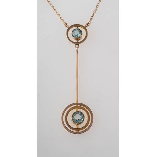 830 - An early 20th century aquamarine set necklace, a fine trace chain suspending a double circle and bar... 