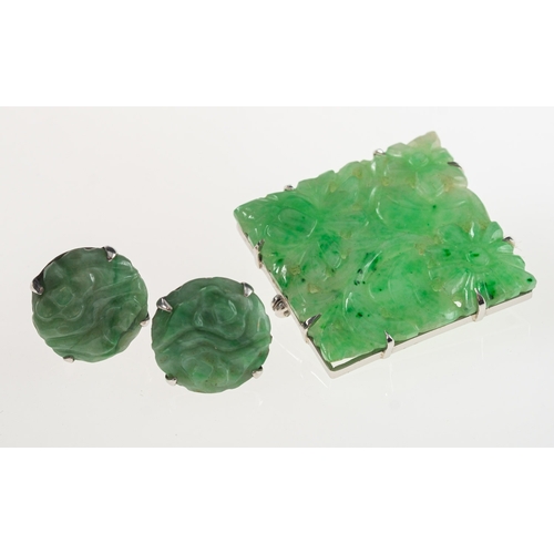 846 - Two items of carved jade jewellery, including a square shaped brooch, the jade carved in a pierced f... 