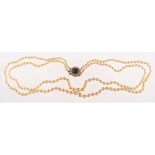 869 - A double row cultured pearl necklace, two rows of graduated cultured pearls, ranging from 3.5mm to 7... 