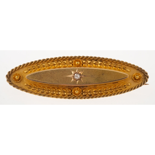 878 - A 15ct gold early 20th century mourning brooch, of ornate oval design, star set with a single old-cu... 