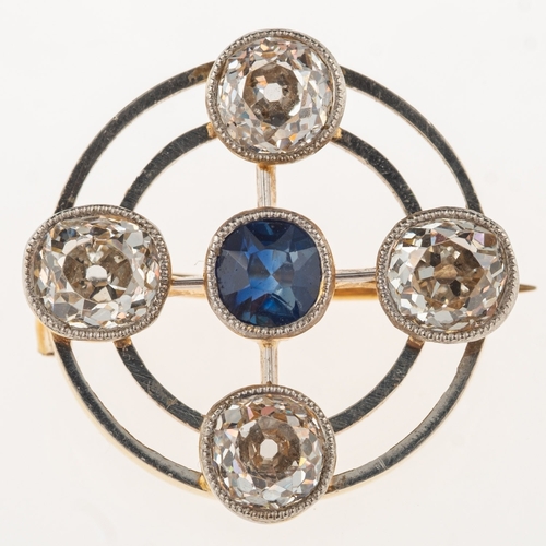 882 - An antique sapphire and diamond brooch, of circular openwork form and set to the centre with a circu... 