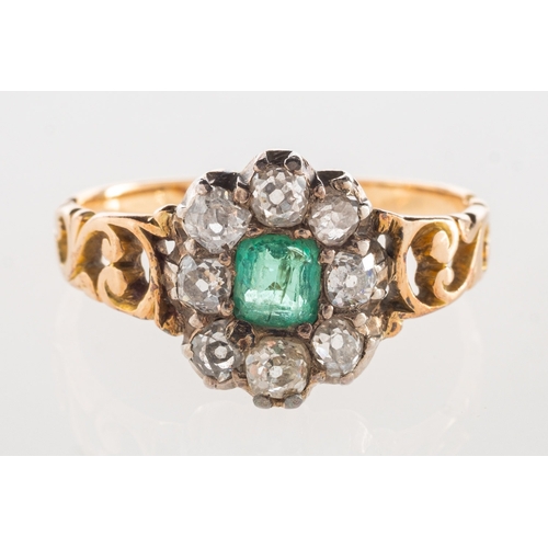 888 - An antique emerald and diamond cluster ring, set to the centre with a rectangular-cut emerald with a... 