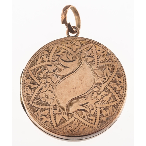 892 - A circular locket, with foliate and floral engraving, unmarked, diameter approx. 3.0cm, 6.5grams.