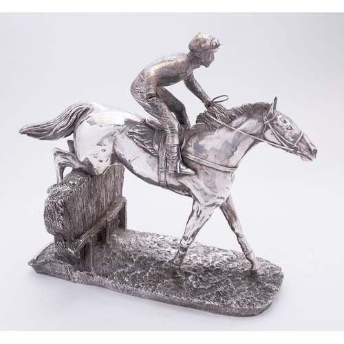 9 - An Elizabeth II silver covered resin horse racing sculpture 'Over the Sticks' by Camelot Silverware ... 