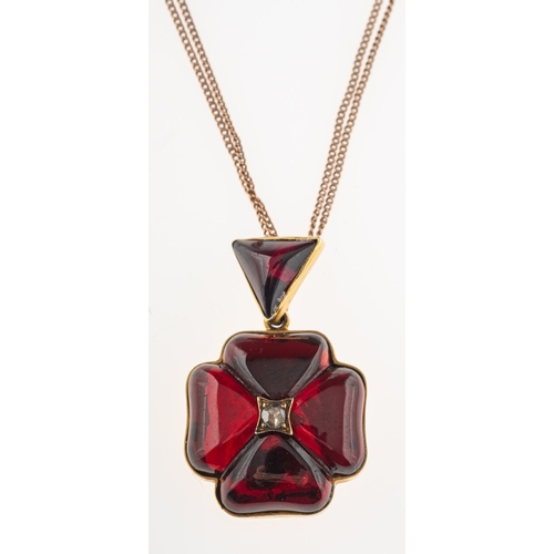 906 - An antique quatrefoil garnet pendant, set to the centre with a rose-cut diamond with a surround of f... 