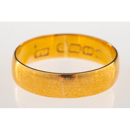 909 - An 22ct gold wedding band, UK hallmark, size N, 3.4grams.