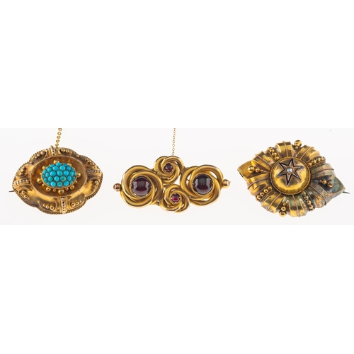 913 - A group of three antique brooches, including an ornate brooch set to the centre with a seed pearl wi... 