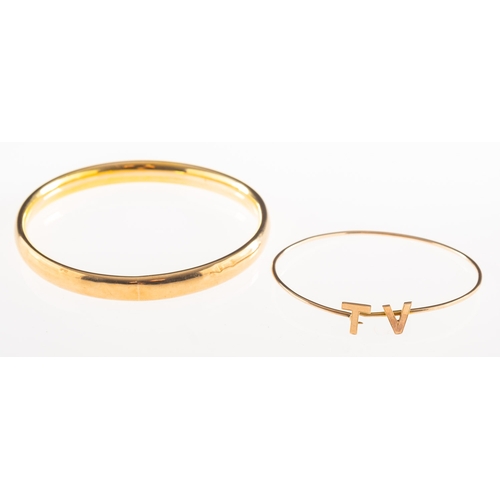 914 - Two antique bangles, including a 9ct gold plain hollow bangle/arm cuff, UK hallmark, inner diameter ... 