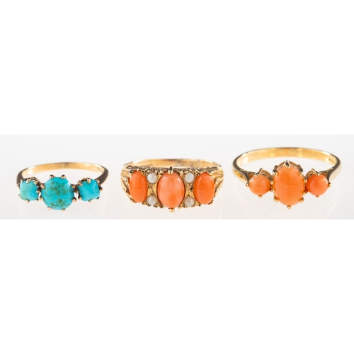 920 - A group of three rings, including a 9ct gold gypsy style ring set with three oval coral cabochons an... 