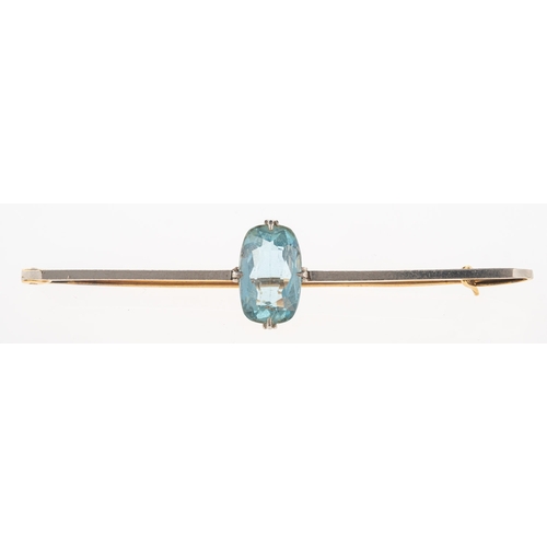 926 - A 1920's aquamarine brooch, a bi-metal bar brooch set with an oval mixed-cut aquamarine, aquamarine ... 