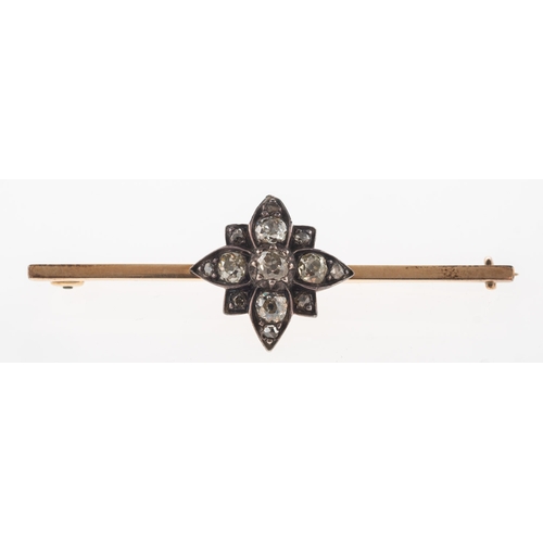 930 - An antique diamond bar brooch, possibly Georgian, a bar brooch with a central flowerhead decoration ... 