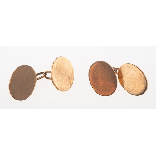 932 - A pair of cufflinks, of oval form with chain link fitting, marked 9ct, 10.4grams.