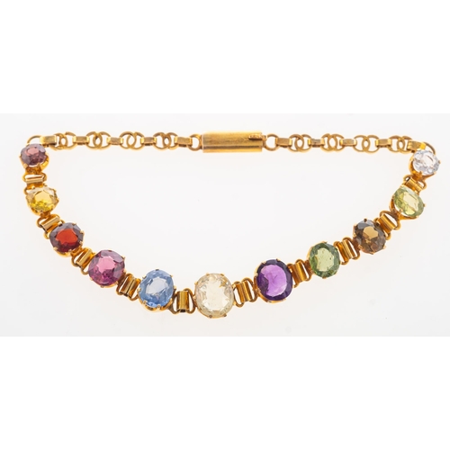 943 - An Art Deco multi-stone bracelet, set with an array of multi-coloured gemstones including white sapp... 