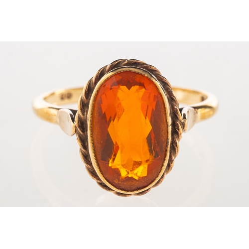 972 - A 9ct gold ring, bezel and rope twist set with an oval-cut orange stone, UK hallmark, size Q1/2, 3.4... 