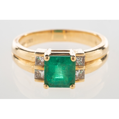 974 - An emerald and diamond ring, claw set with a rectangular-cut emerald, set each side with two princes... 