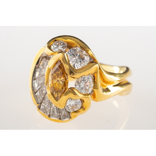 983 - A handmade fancy yellow diamond and white diamond ring, of abstract design, set to the centre with a... 