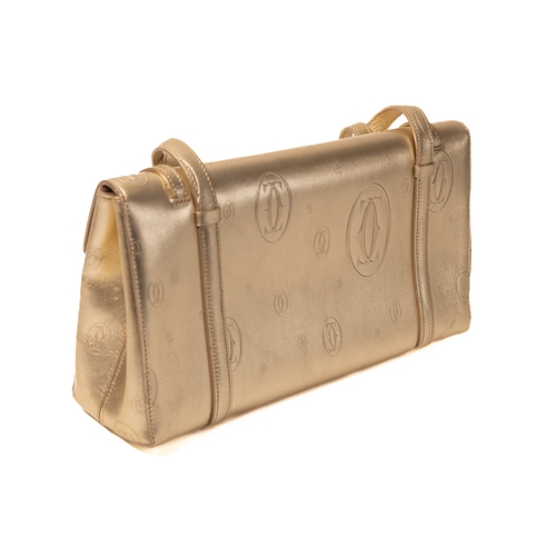 541 - Cartier. A gold monogrammed exterior, beige suede interior, gold hardware and gold safety bar inset ... 