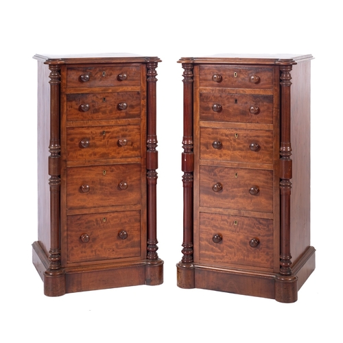 1007 - A pair of Victorian mahogany pedestal bedside chests, with moulded tops and projecting rounded corne... 