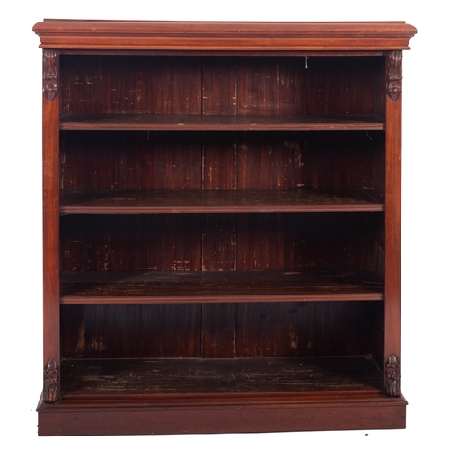 1013 - A Victorian mahogany open bookcase, with a moulded top, fitted with fixed shelves flanked by stiles ... 