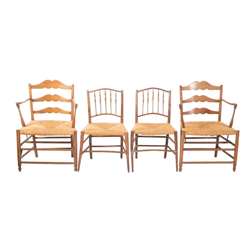 1018 - A pair of rush seated ash elbow chairs, in late 18th century taste, late 19th century; with shaped l... 