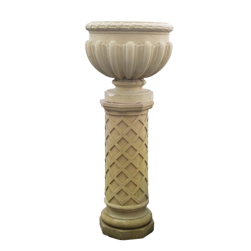 1173 - A stone composition urn on pedestal, probably by Haddonstone, modern; with beribboned and reeded rim... 