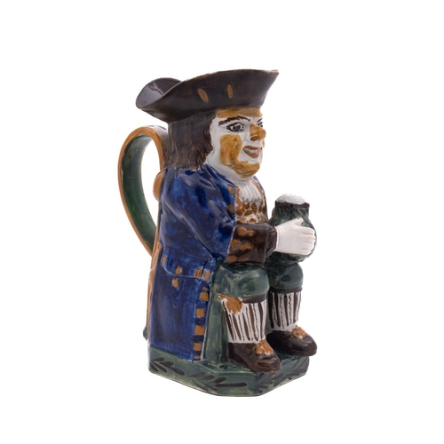 142 - A Yorkshire pearlware toby jug decorated in Pratt colours, wearing a blue coat, green breeches and s... 