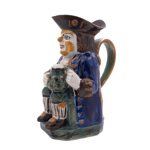 142 - A Yorkshire pearlware toby jug decorated in Pratt colours, wearing a blue coat, green breeches and s... 